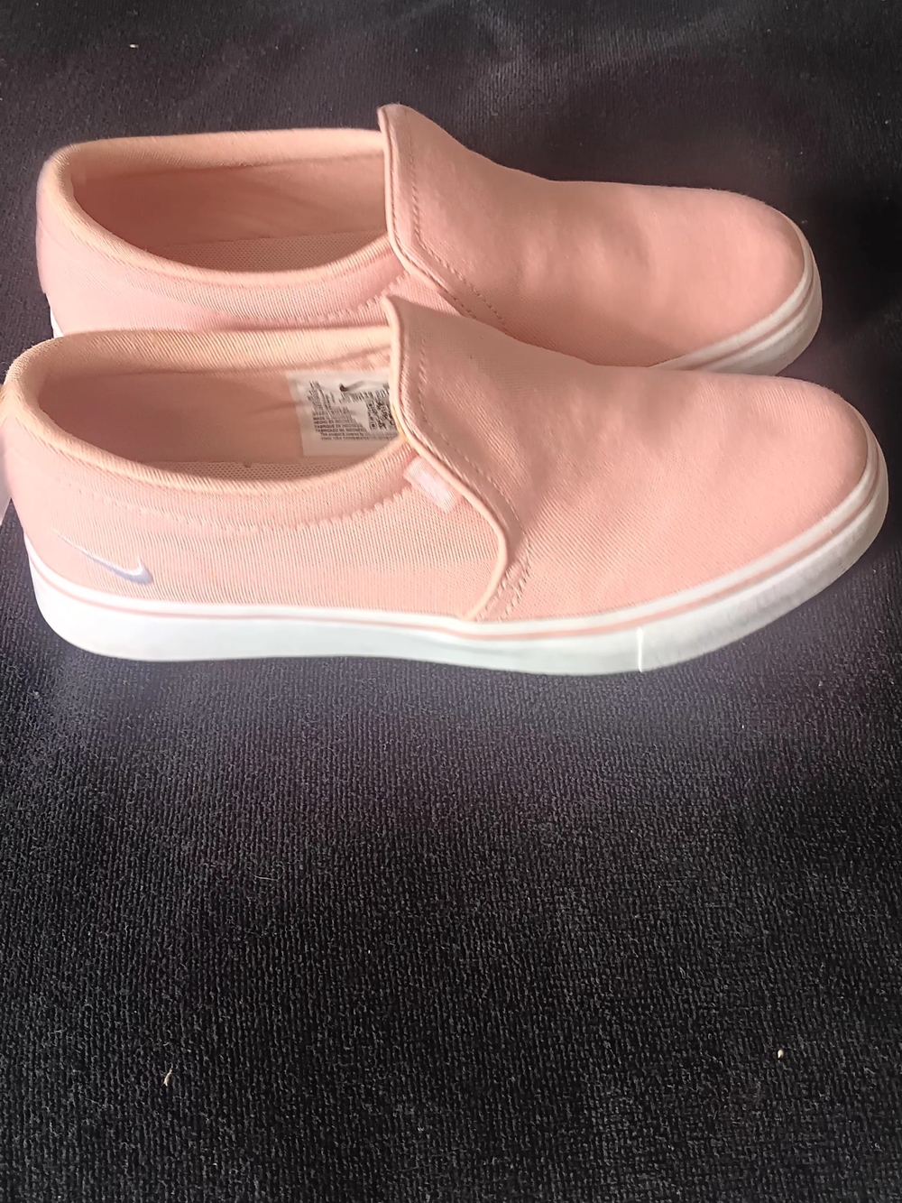 Nike Women’s Slip-On Canvas Sneakers in Light Pink